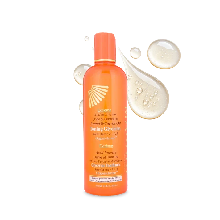 Makari Extreme Argan and Carrot Oil bottle with a clear label, surrounded by natural ingredients, on a white background