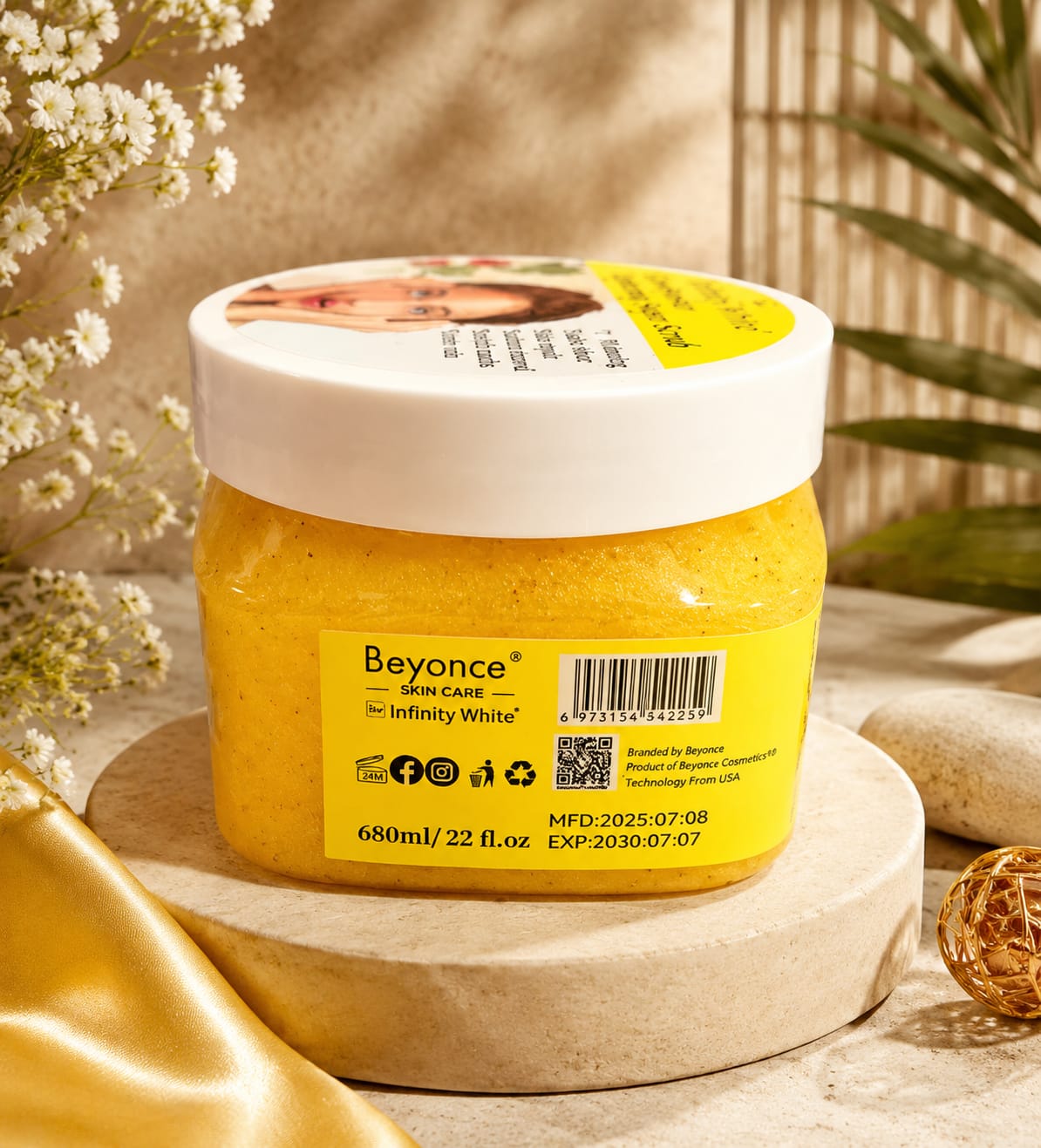 Infinity White Glow Booster Sugar Scrub jar with white and pink packaging, featuring a textured sugar scrub inside.