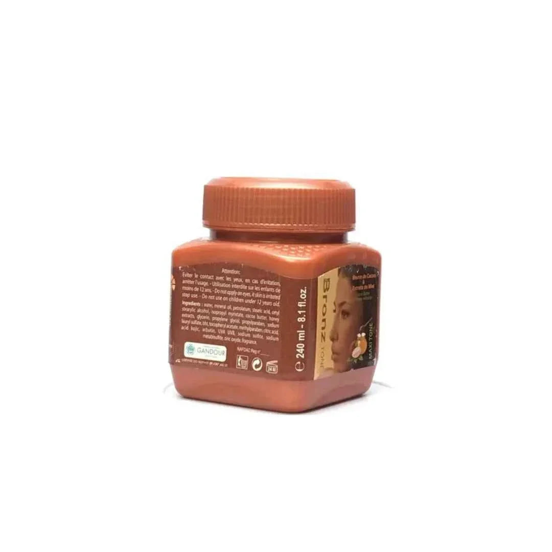 Bronz Tone Cocoa Butter & Honey Body Cream in 8.1 oz jar, rich moisturizer with a creamy texture and bronze-toned packaging.