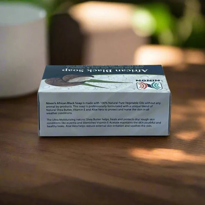 African Black Soap with Shea Butter in 5oz bar, showing dark textured soap with shea butter ingredients for nourishing skin.