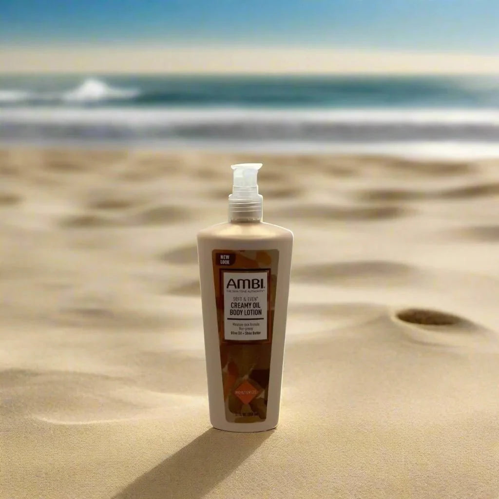 Ambi Skincare Soft & Even Creamy Oil Body Lotion in a 12 fl oz bottle, showing smooth, moisturizing lotion with soft texture.