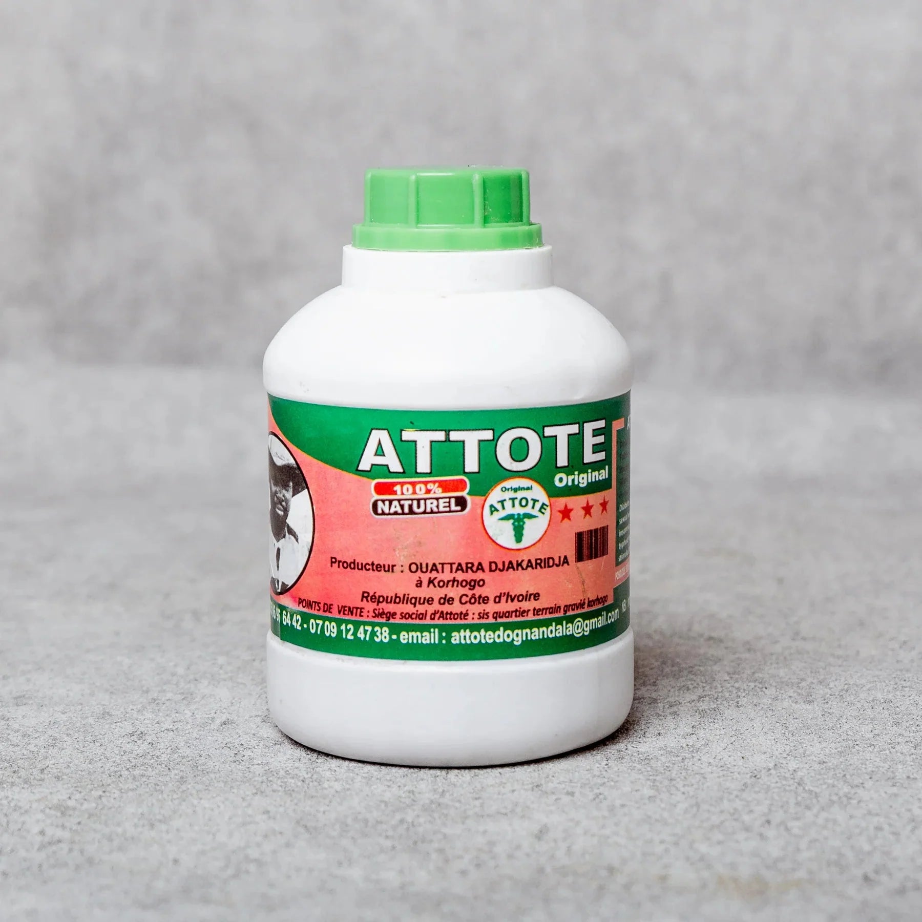 Bottle of Attote Original Organic Herbal Drink featuring natural herbal ingredients and a clear label, showcasing a healthy beverage.