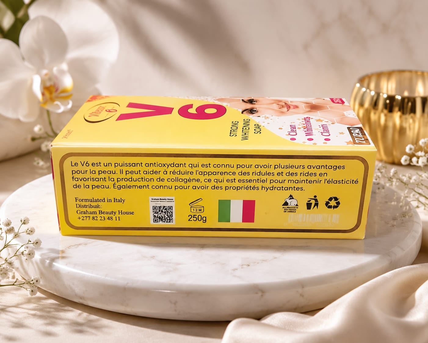 Vitesse V6 Beauty Soap 250g bar with smooth white surface and embossed V6 logo, ideal for skin cleansing and freshening.