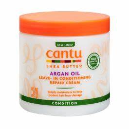 Cantu Argan Leave-In Conditioning Cream 16oz jar with creamy texture, designed for nourishing and moisturizing hair.