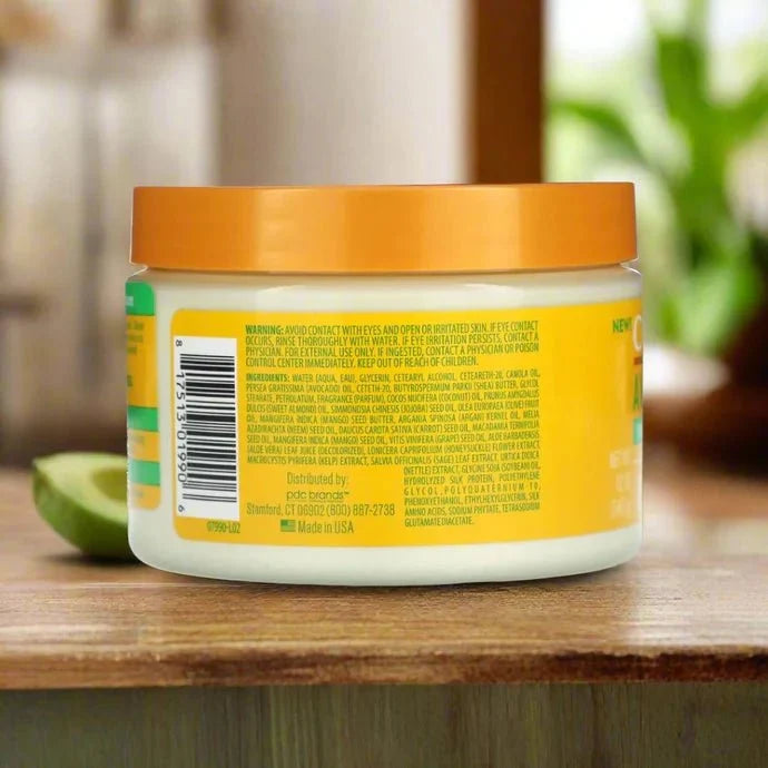 Cantu Avocado Curling Cream 12oz jar with creamy texture, designed for defining and moisturizing curly hair.