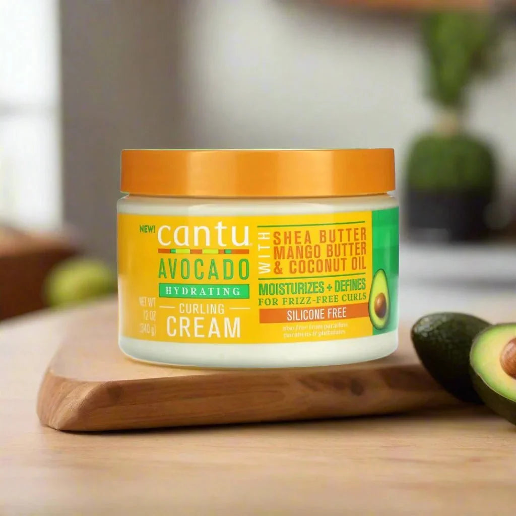 Cantu Avocado Curling Cream 12oz jar with creamy texture for defining and moisturizing curly hair.