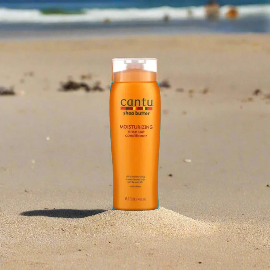 Cantu Shea Butter After Shampoo Rinse Out Conditioner 13.5 oz bottle with white label and pump dispenser, designed for nourishing hair.