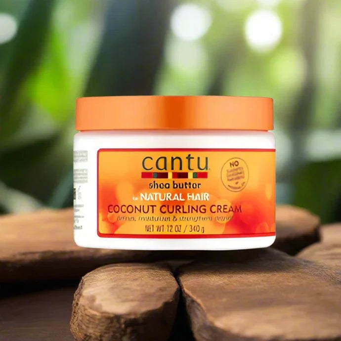 Cantu Shea Butter Coconut Curling Cream 12 oz jar with creamy texture, designed for defining and moisturizing curly hair.
