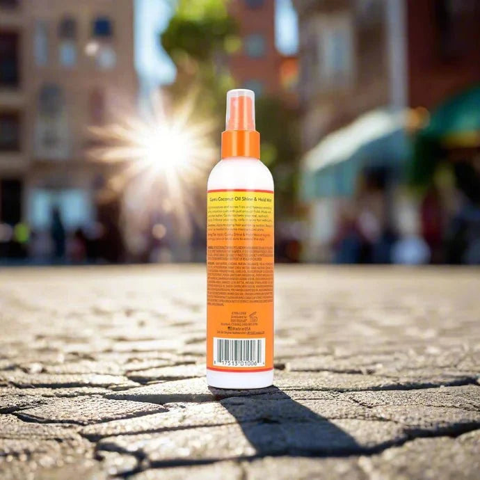 Cantu Shea Butter Coconut Spray Mist in 8oz bottle, featuring a spray nozzle and creamy coconut and shea butter formula for hair hydration.