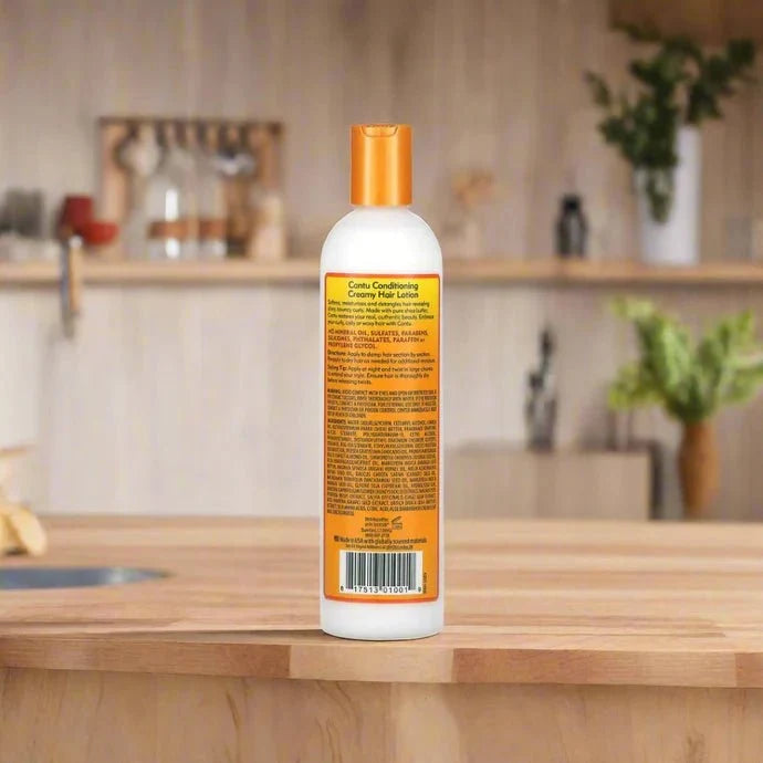 Cantu Shea Butter Curl Activator Cream in 12oz jar, showing the white cream with a textured lid, ideal for defining curly hair.