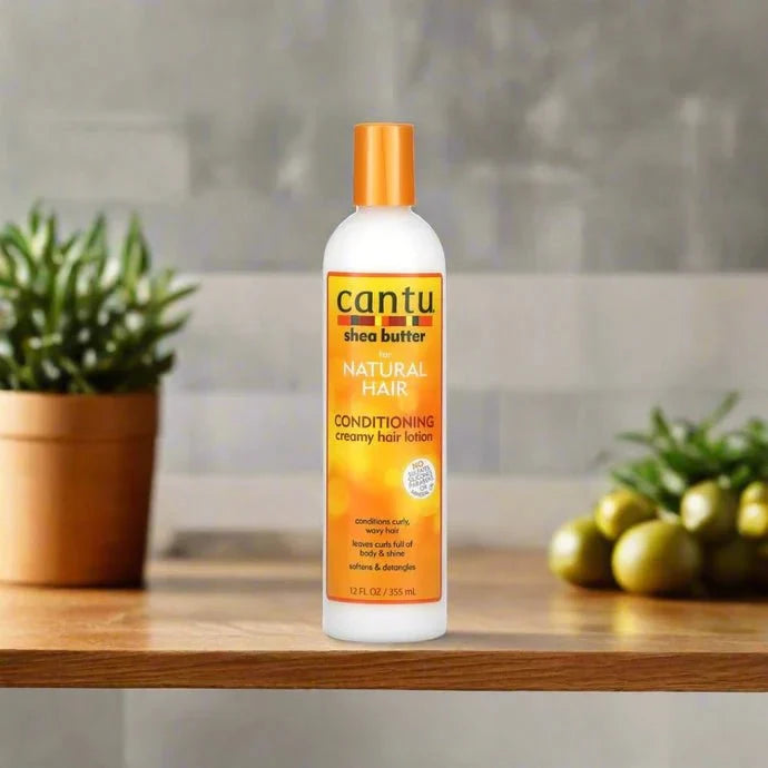Cantu Shea Butter Curl Activator Cream in 12oz jar, showing the product label and creamy texture for curly hair styling.
