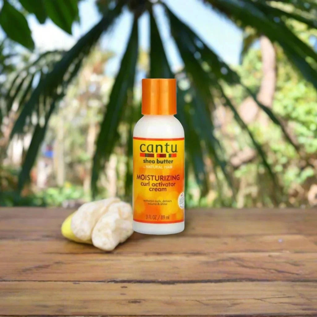 Cantu Shea Butter Moisturizing Curl Activator Cream in 3 oz jar, showcasing its creamy texture and curl-enhancing formula.