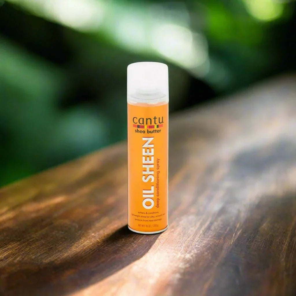 Cantu Shea Butter Oil Sheen Spray 10 oz enhances hair shine with moisturizing shea butter for smooth, healthy hair.