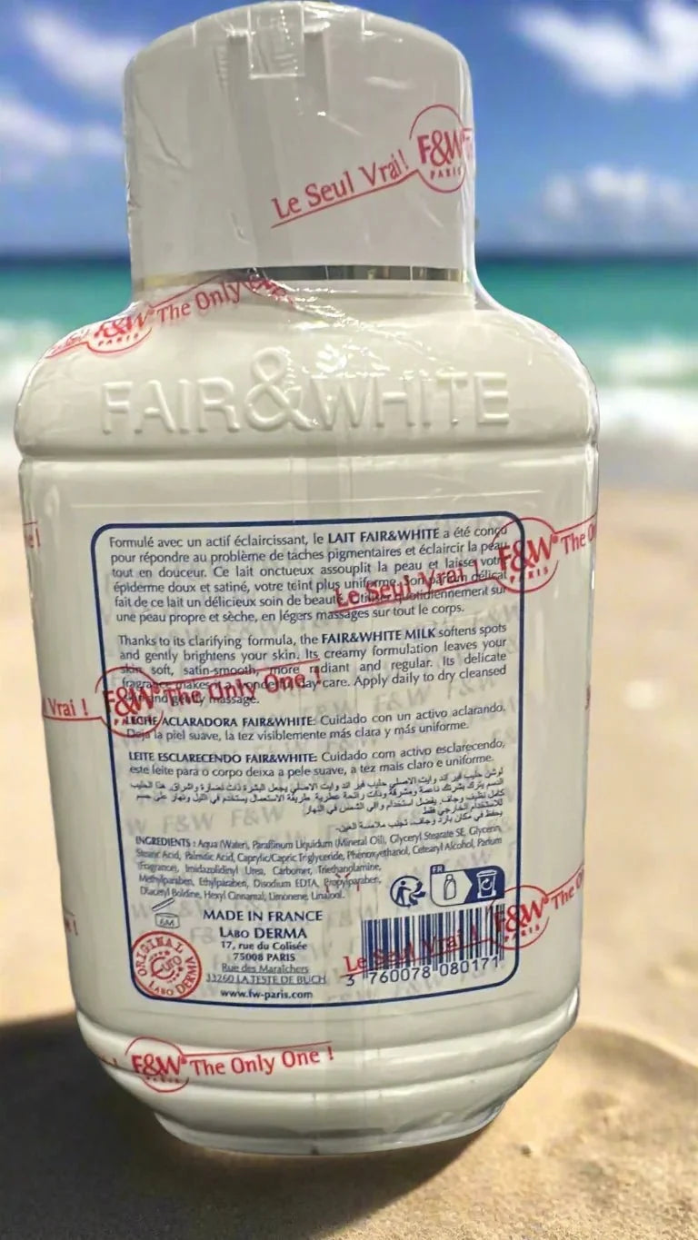 Fair & White Original Body Milk Lotion bottle showing white lotion inside a clear 17 oz (500 ml) container with label.
