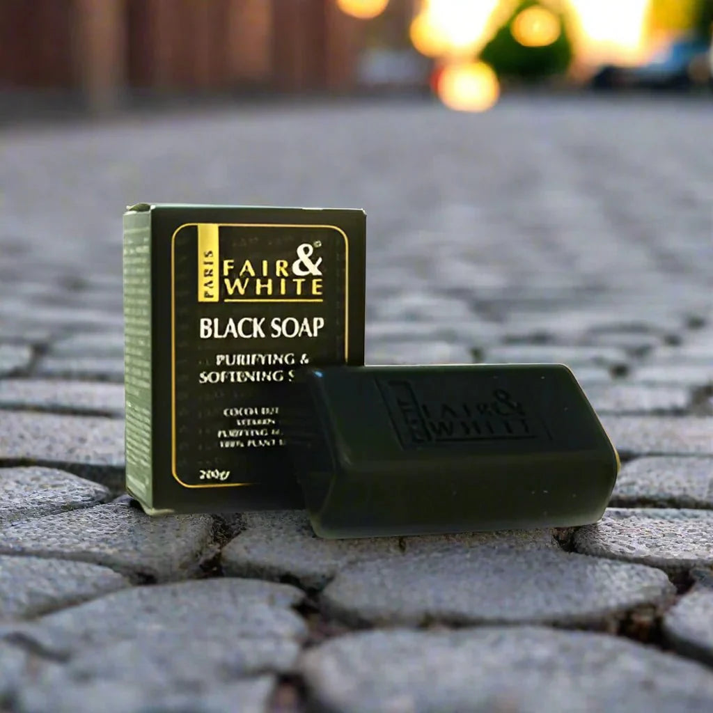 Fair & White Original Purifying Black Soap in a 7 oz bar, with black color and textured surface, designed for skin cleansing.