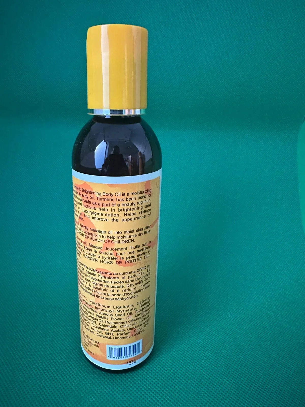 Civic Turmeric Body Oil in a 180 ml bottle with a clear glass container and golden oil inside, designed for skincare.