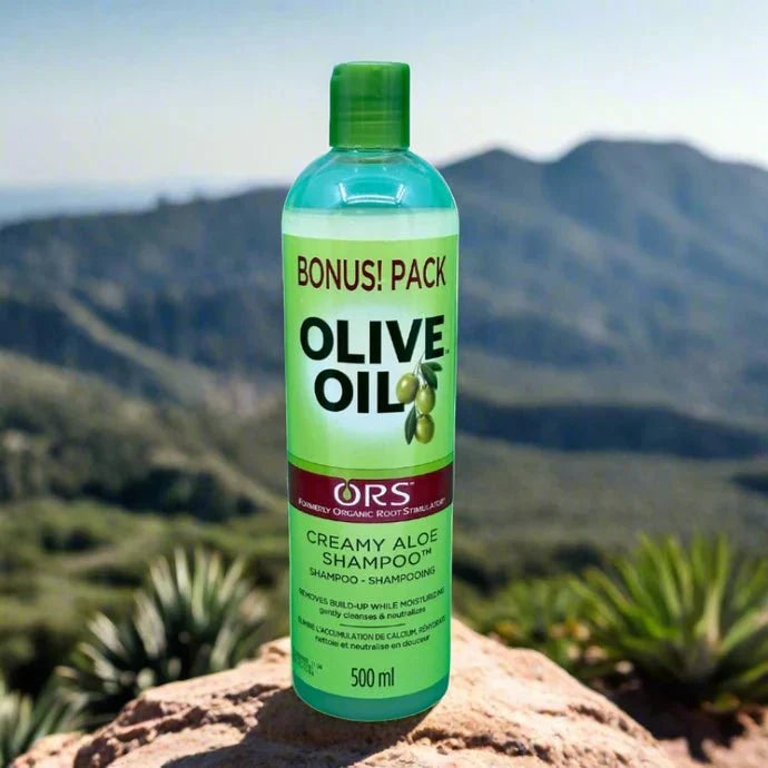Creamy Aloe Shampoo by ORS in 500 ml bottle, featuring a clear container with a white and green label, designed for hair care.