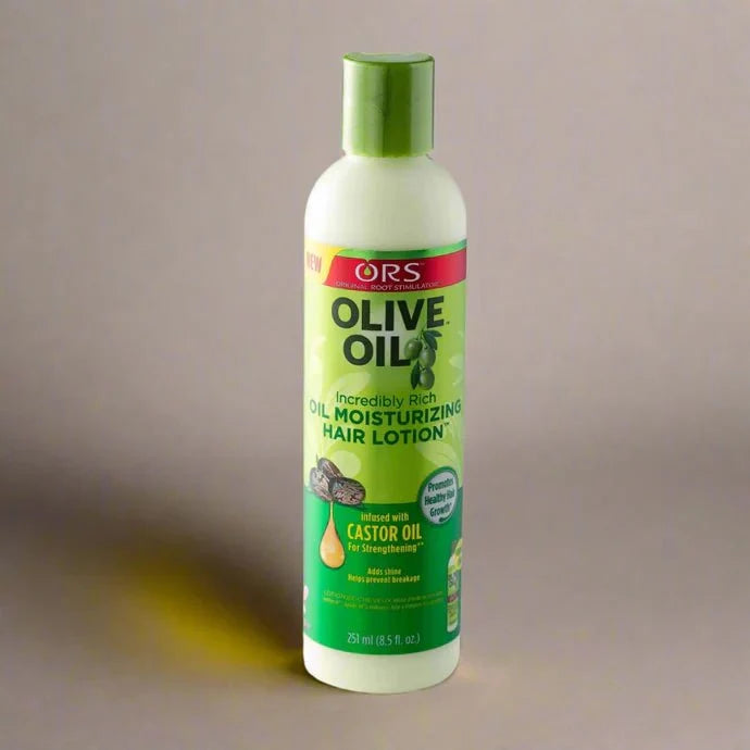 ORS Oil Moisturizing Hair Lotion bottle, 8.5 fl oz, featuring the product label and packaging for nourishing hair care.