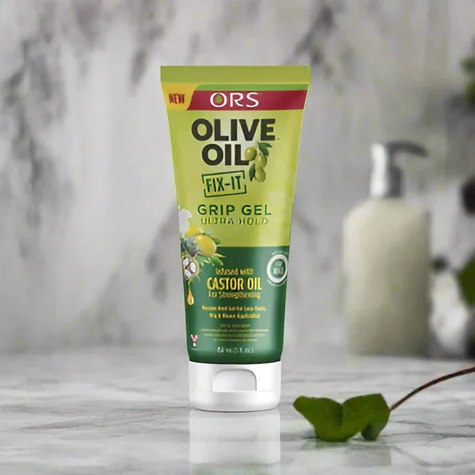 ORS Olive Fix-It Ultra Hold Grip Hair Gel in a 5 oz container with a clear gel texture and green and white packaging.