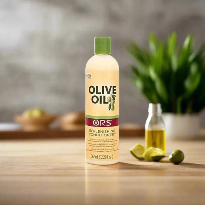 ORS Olive Replenishing Conditioner in 12.25 oz bottle, featuring a sleek green and white design with botanical accents.