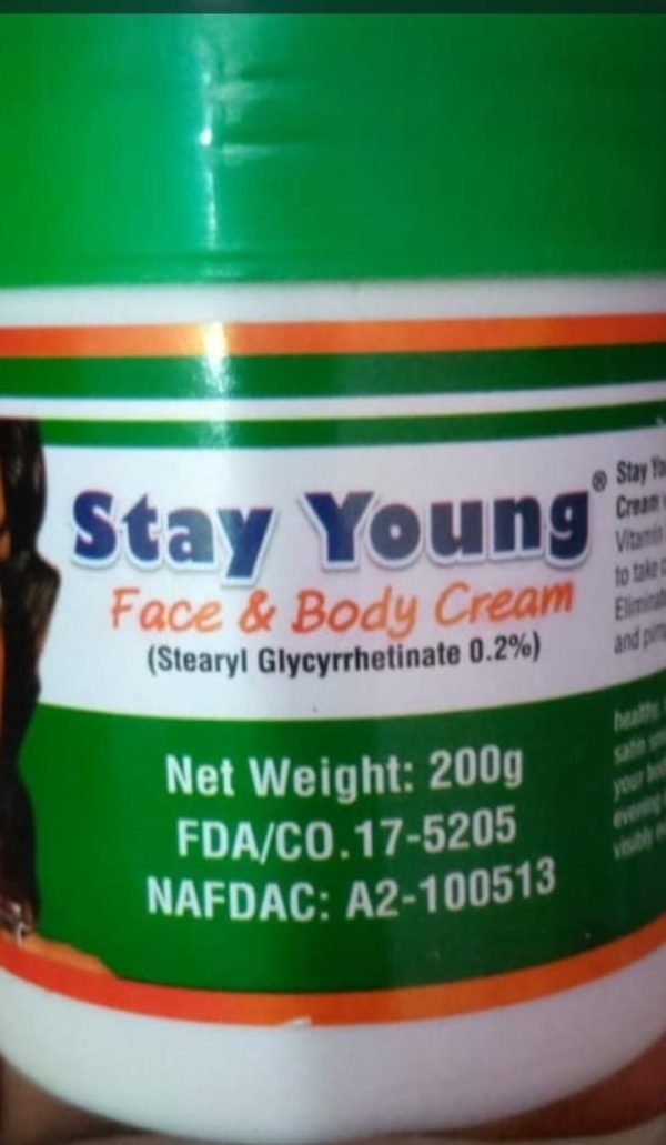 Stay Young Face and Body Cream jar showing the creamy product in a sleek container with a white lid.