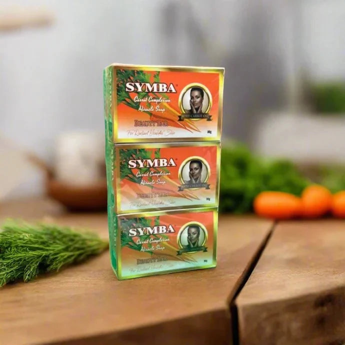 Six bars of Symba Carrot Complexion Soap, 80g each, in a pack, featuring vibrant orange soap with carrot extract for skin radiance